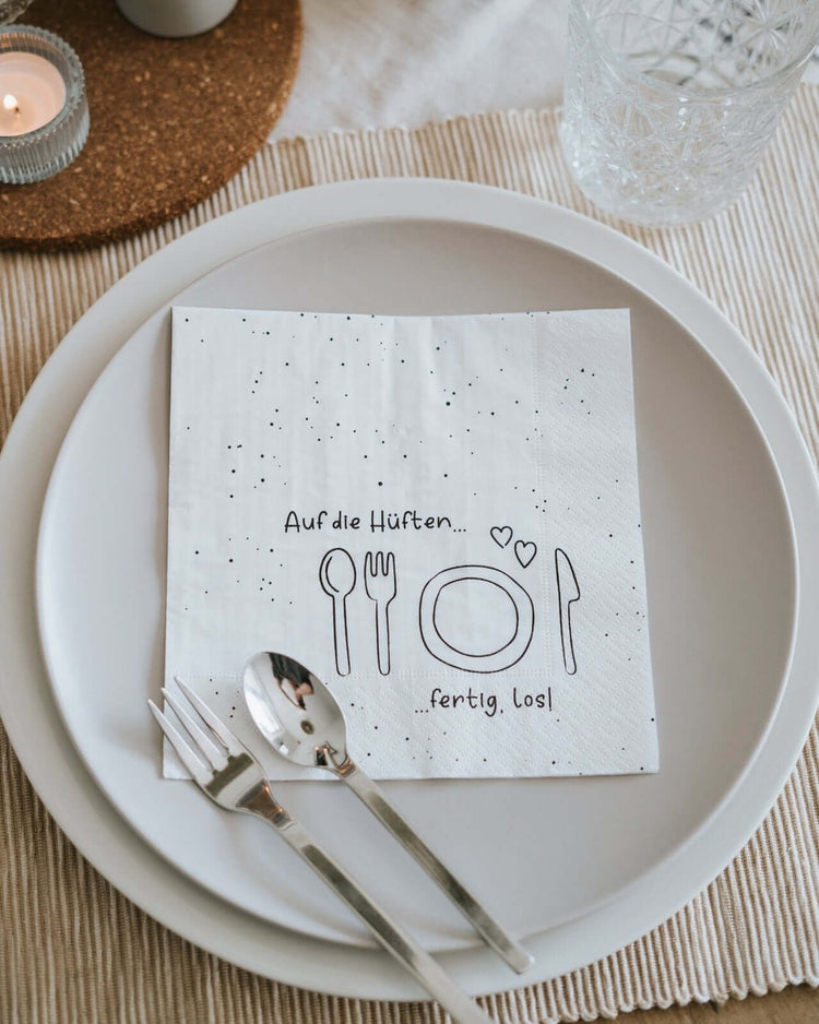 Serviette mit Spruch oder Motiv Auf die Hüften in schwarz weiss