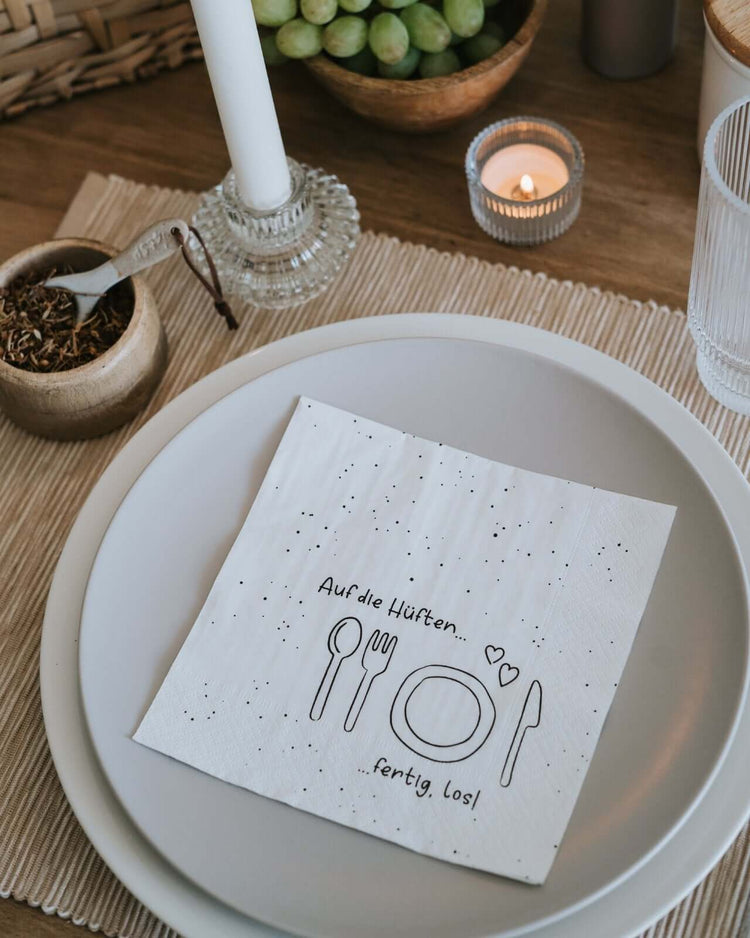 Serviette mit Spruch oder Motiv Auf die Hüften in schwarz weiss