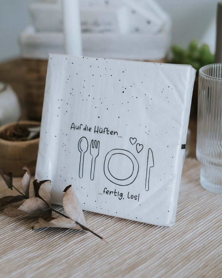 Serviette mit Spruch oder Motiv Auf die Hüften in schwarz weiss