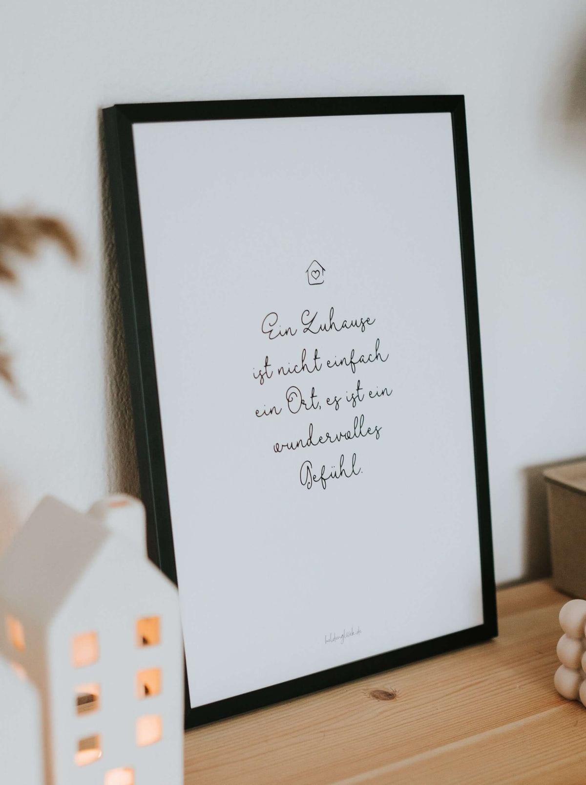 Poster mit Spruch oder Motiv Zuhause ist ein Gefühl in schwarz weiss