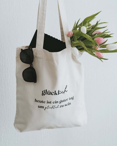 Baumwollbeutel mit Spruch oder Motiv Glücklich sein in schwarz weiss
