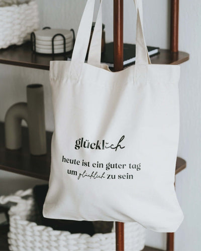 Baumwollbeutel mit Spruch oder Motiv Glücklich sein in schwarz weiss