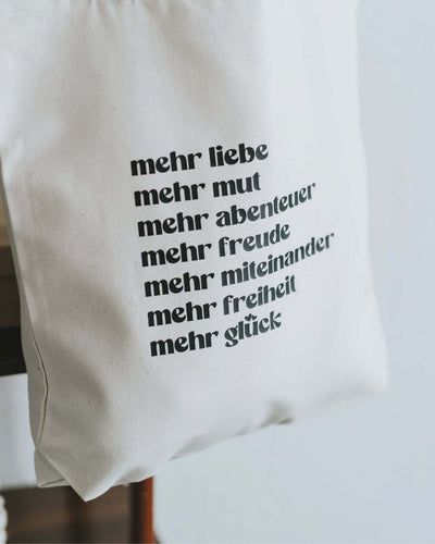 Baumwollbeutel mit Spruch oder Motiv Mehr Liebe in schwarz weiss