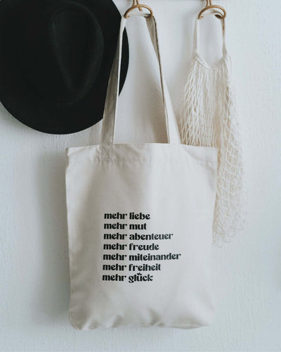 Baumwollbeutel mit Spruch oder Motiv Mehr Liebe in schwarz weiss