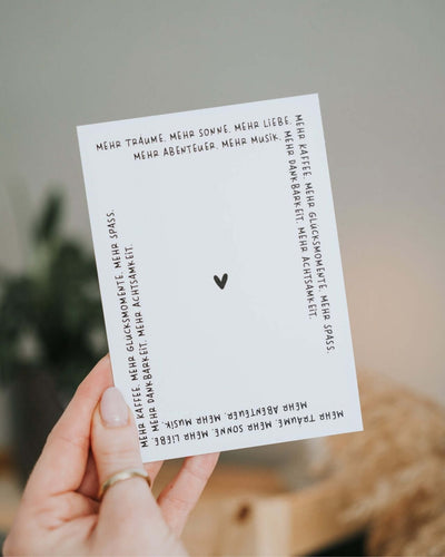 Postkarte mit Spruch und motiv Mehr Träume in schwarz weiss