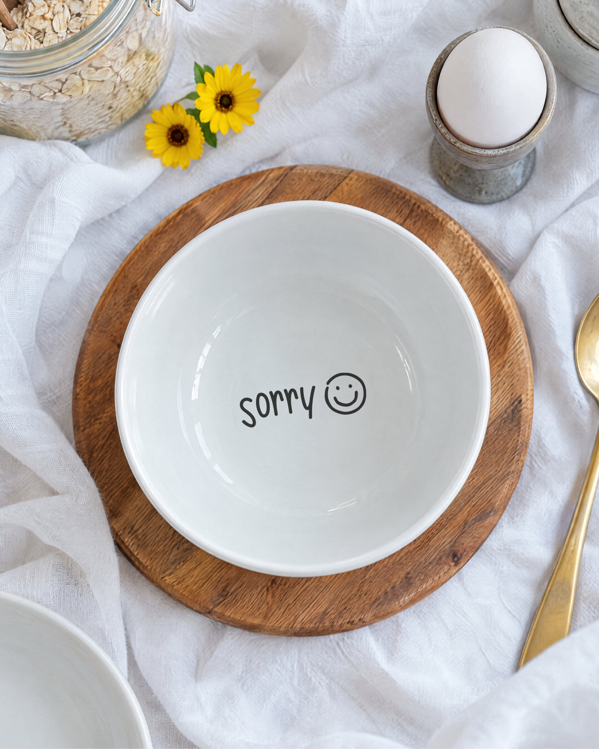 Boden der Porzellanschale mit zweitem Spruch „sorry“ und Smiley.