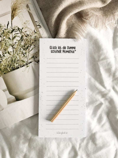 Notizblock „Momente" mit Spruch – handliches Format neben der Tastatur
