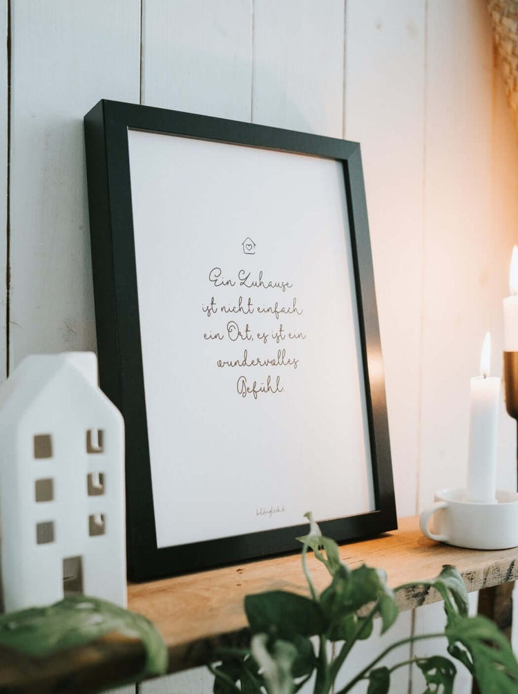 Poster mit Spruch oder Motiv Zuhause ist ein Gefühl in schwarz weiss